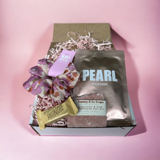 Pink Gift Box with brightening peach face sheet mask, grapefruit and pink himalayan salt bar, blondie Whitakers chocolate and pink floral srunchie 
